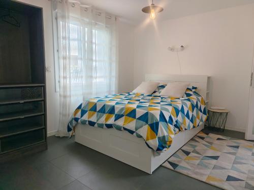 Postel nebo postele na pokoji v ubytování Gîte PEGASUS - 5 min plage