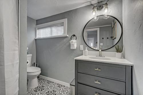 a bathroom with a sink and a mirror at Neighborly Heights - Downtown King BBQ Fire Pit in Colorado Springs