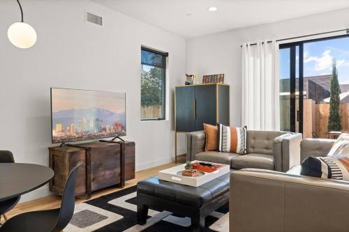 a living room with a couch and a table at Rooftop 3B 3BA House Near Dodger Stadium and DTLA in Los Angeles
