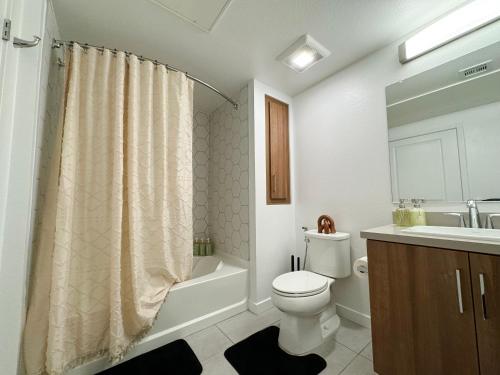 a bathroom with a toilet and a sink and a shower at Spacious Hollywood Home Sunset View-Free Parking 10mins to Universal Studios in Los Angeles