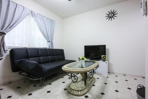 a living room with a couch and a table at 3, Kameido, Entire house for rent, 亀戸 in Tokyo