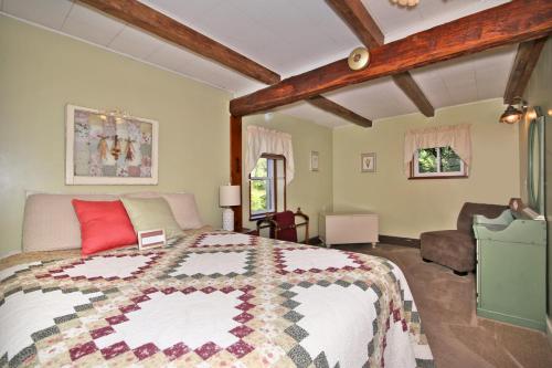 a bedroom with a large bed and a couch at Creekside Farmstead Hot Tub with Brand New Pool and BBQ in Auburn