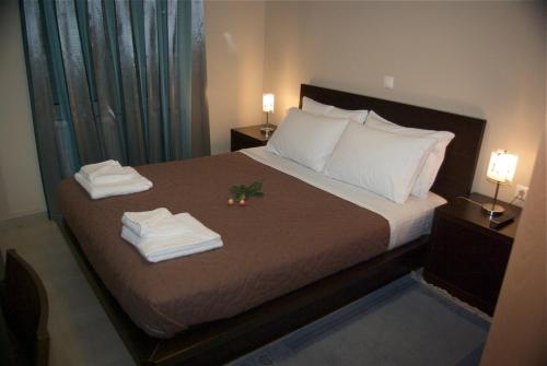 Кровать или кровати в номере Xenonas Ioanni Parcha