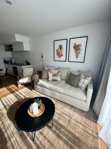 a living room with a couch and a table at Riverside Escape in Albert Town