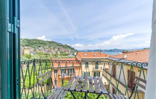 a balcony with a bench and a view of a city at 2 Bedroom Lovely Apartment In Le Grazie in Le Grazie