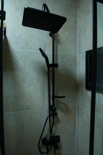 a shower head on a stand in a bathroom at İstanbul Eagle's Nest Boutique Hotel in Istanbul