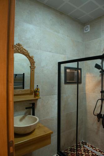 a bathroom with a sink and a mirror at İstanbul Eagle's Nest Boutique Hotel in Istanbul