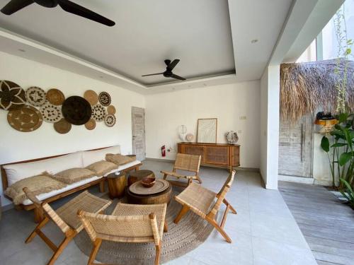 a living room with a couch and chairs and a table at Villa Mei, 2BR Pool, Seseh Beach in Dalung