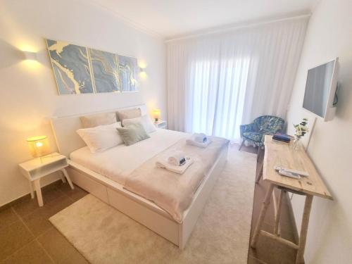 a bedroom with a large bed in a room at Villa Marcia Home - Nature, Golf, Beaches-Lagos in Portimão