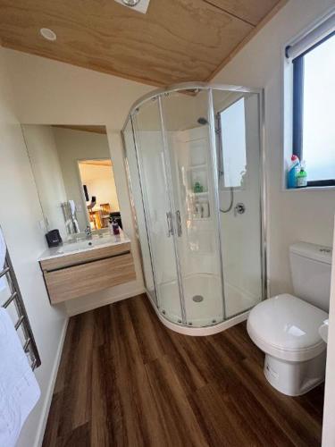 a bathroom with a shower and a toilet at Country Retreats On Ranzau 0 in Hope
