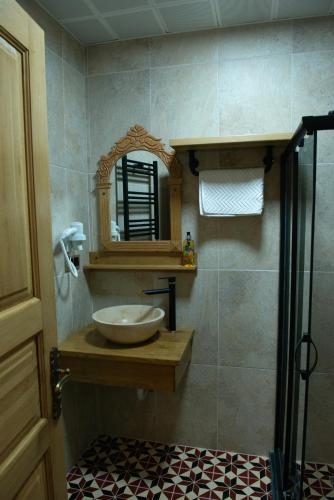 a bathroom with a sink and a mirror at İstanbul Eagle's Nest Boutique Hotel in Istanbul