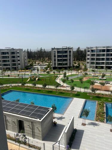 an overhead view of a swimming pool in a city at Sunset Gardens - Holiday Apartments - by TLV Living in Limassol