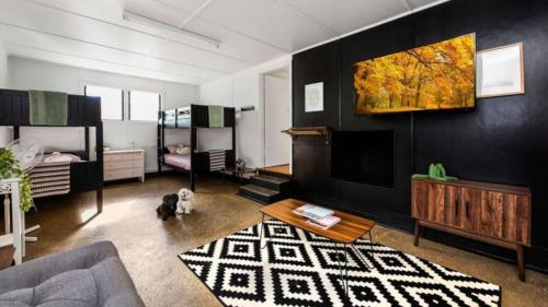 a living room with a couch and a tv at Scotts Cottage in Scotts Head
