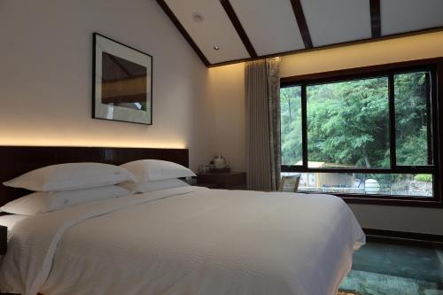 Fuxi-21 Homestayにあるベッド