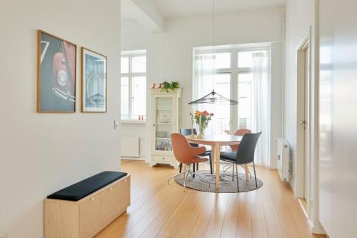a dining room with a table and chairs at Top Location - Citycenter - Balcony in Copenhagen