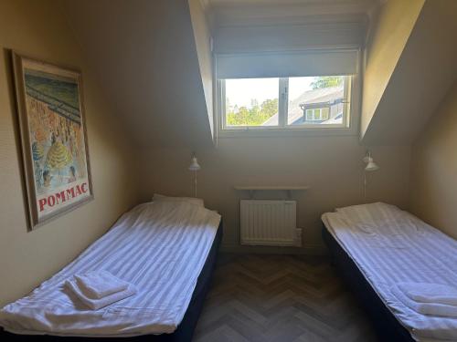 Tempat tidur dalam kamar di Tofta Bed & Breakfast
