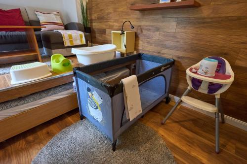a toy room with a tv and a bed at Giselle Apartment in Budapest