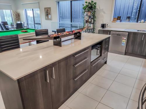 a kitchen with a large island in a kitchen at Dream Clyde Family Home Movie Theater and Pool Table in Clyde