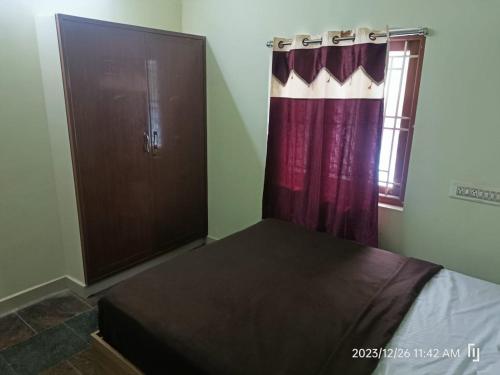 Postel nebo postele na pokoji v ubytování BNS Village Resort