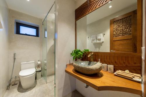 a bathroom with a sink and a toilet at Bonny Boutique Hotel Da Nang in Da Nang
