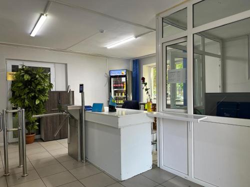 a room with a white counter in a store at Student Castle Almaty hostel in Almaty