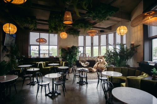 a restaurant with tables and a teddy bear sitting in the middle at Nordic Hostel in Reykjavík