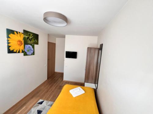 a room with a bed and a wall at 1912 Bed & Breakfast in Klaipėda