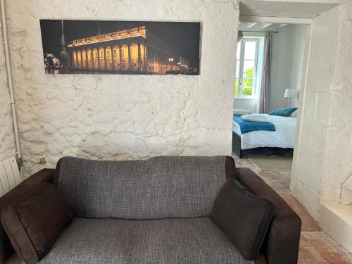 Ένα ή περισσότερα κρεβάτια σε δωμάτιο στο Château Lafite Monteil - proche Bordeaux