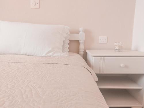 Postel nebo postele na pokoji v ubytování Hotel Maria