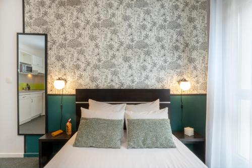 Katil atau katil-katil dalam bilik di Nemea Appart Hotel Home Suite Nancy Centre