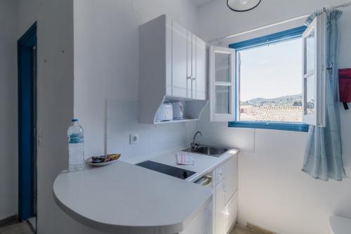 A kitchen or kitchenette at Sunflower Apartments & Studios