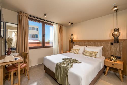 Ένα ή περισσότερα κρεβάτια σε δωμάτιο στο Hotel Pyriá