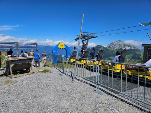 a group of people riding on a roller coaster at Almappartement Nassfeld- Sonnenalpe in Sonnenalpe Nassfeld