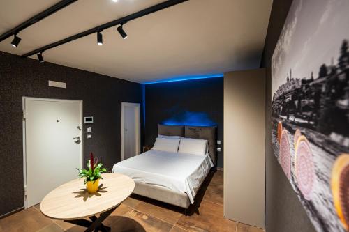 Postel nebo postele na pokoji v ubytování ArcoLoBello B&B ApartHotel