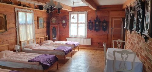Postel nebo postele na pokoji v ubytování Żuławska Chata