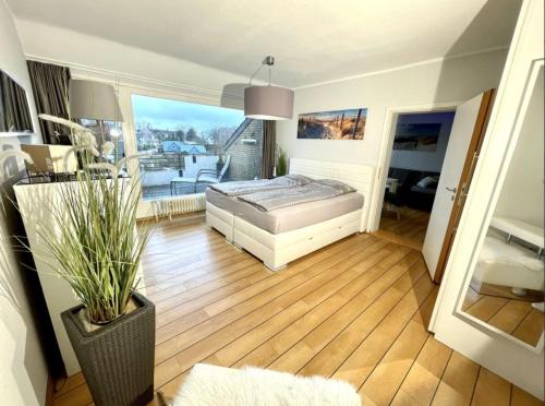 Ένα ή περισσότερα κρεβάτια σε δωμάτιο στο Ferienwohnung Strandperle - nur 150m zum Strand