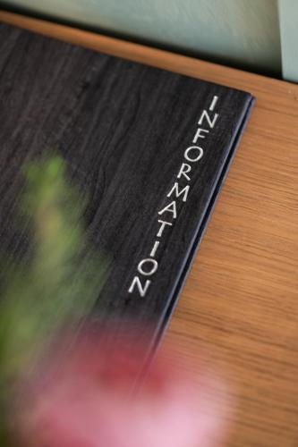 a book sitting on top of a wooden table at Stonehenge Courtyard in Amesbury
