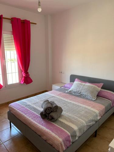 Ένα ή περισσότερα κρεβάτια σε δωμάτιο στο La Casita de Blanca