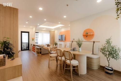 a kitchen and living room with a table and chairs at Tony Apartment -FLC Sea Tower Quy Nhon in Quy Nhon