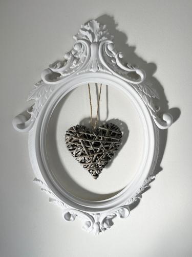 a heart on a plate in a mirror at Villa San Marco in Hvar