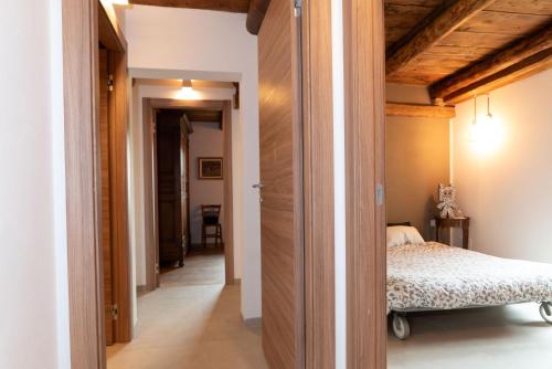 a bedroom with a bed and a hallway at Cicapuy in Puys