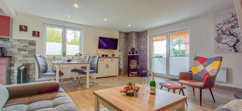 TV a/nebo společenská místnost v ubytování Premiumferienhaus Prana