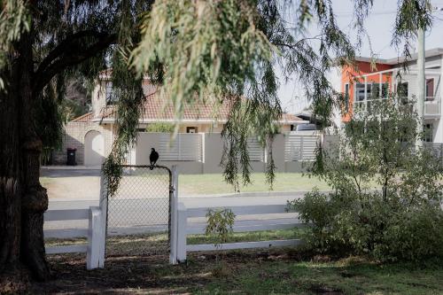 a person walking down the stairs in front of a building at Riverside Retreat in Orford in Orford
