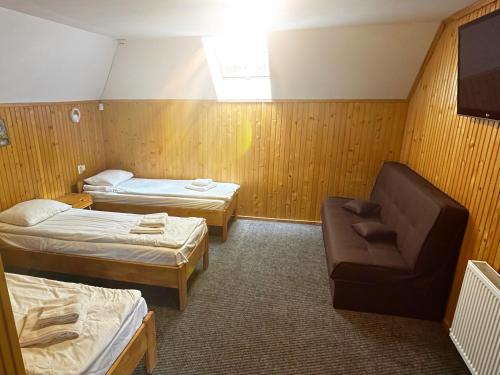 Postel nebo postele na pokoji v ubytování Chalet Filvarok