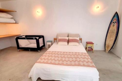 Katil atau katil-katil dalam bilik di Casa Típica com Pátio e Tanque