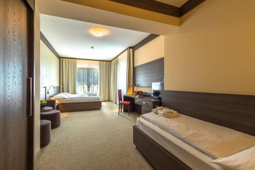 Postel nebo postele na pokoji v ubytování Wellness Hotel Jason