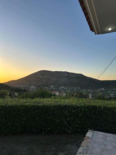 a view of a mountain at sunset from a house at Altera Vita in Agía Zóni