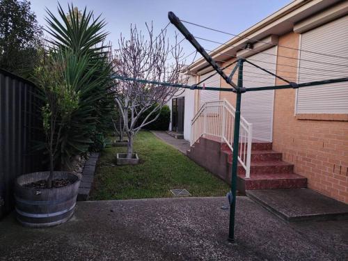 a street sign in front of a house at Home in Greenvale, Victoria in Greenvale