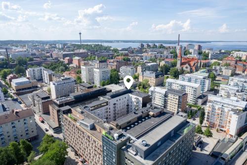 an aerial view of a city with tall buildings at Modern 1BR Apartment with Balcony next to Railway Station - Hosted by 2ndhomes in Tampere