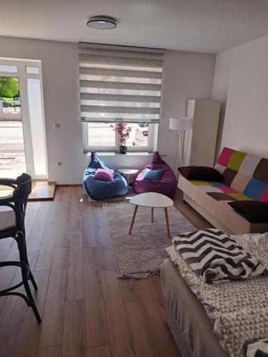 a living room with a couch and a table at Ina in Kupres